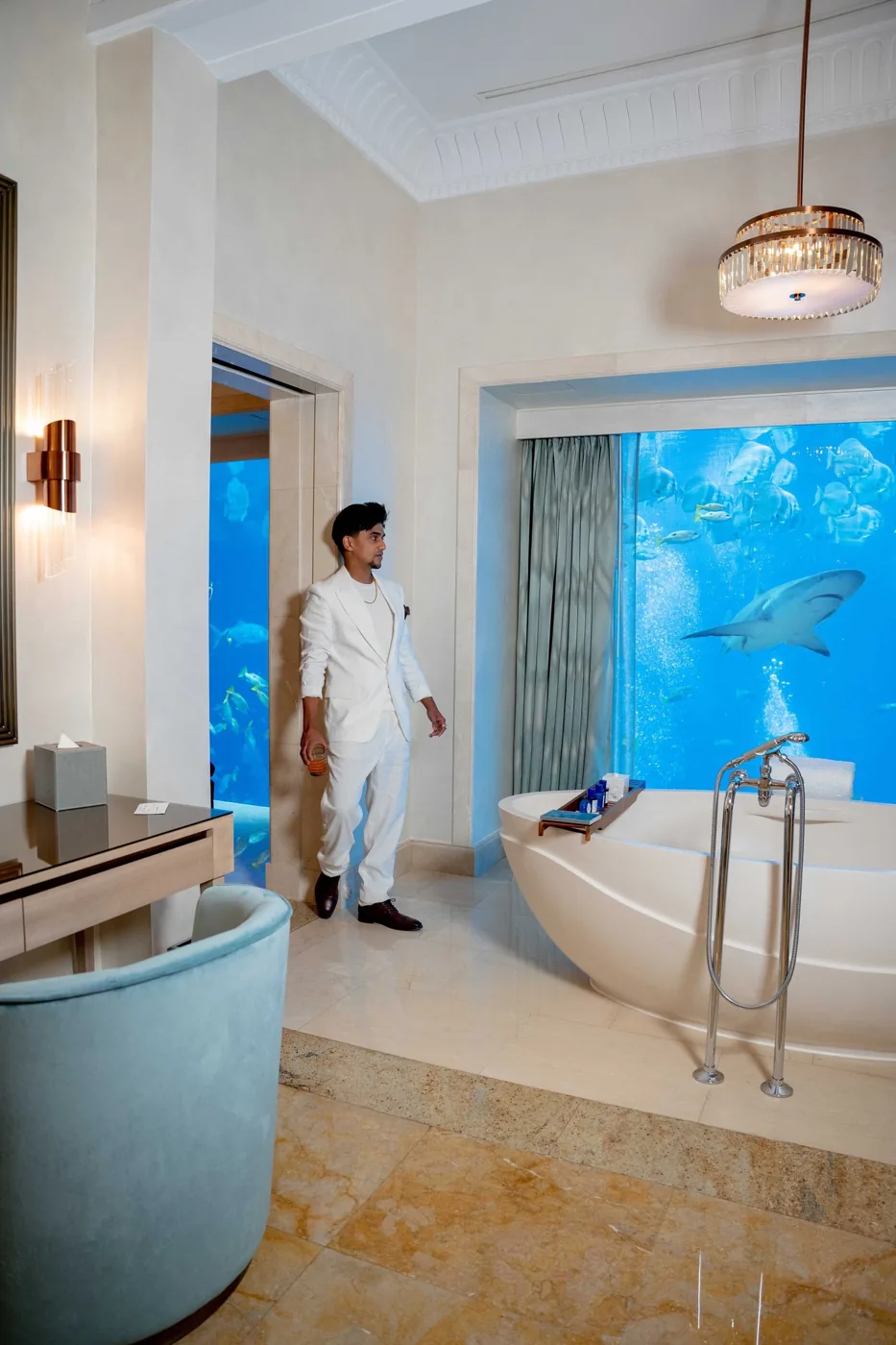 Nabeel standing in a light-filled interior.