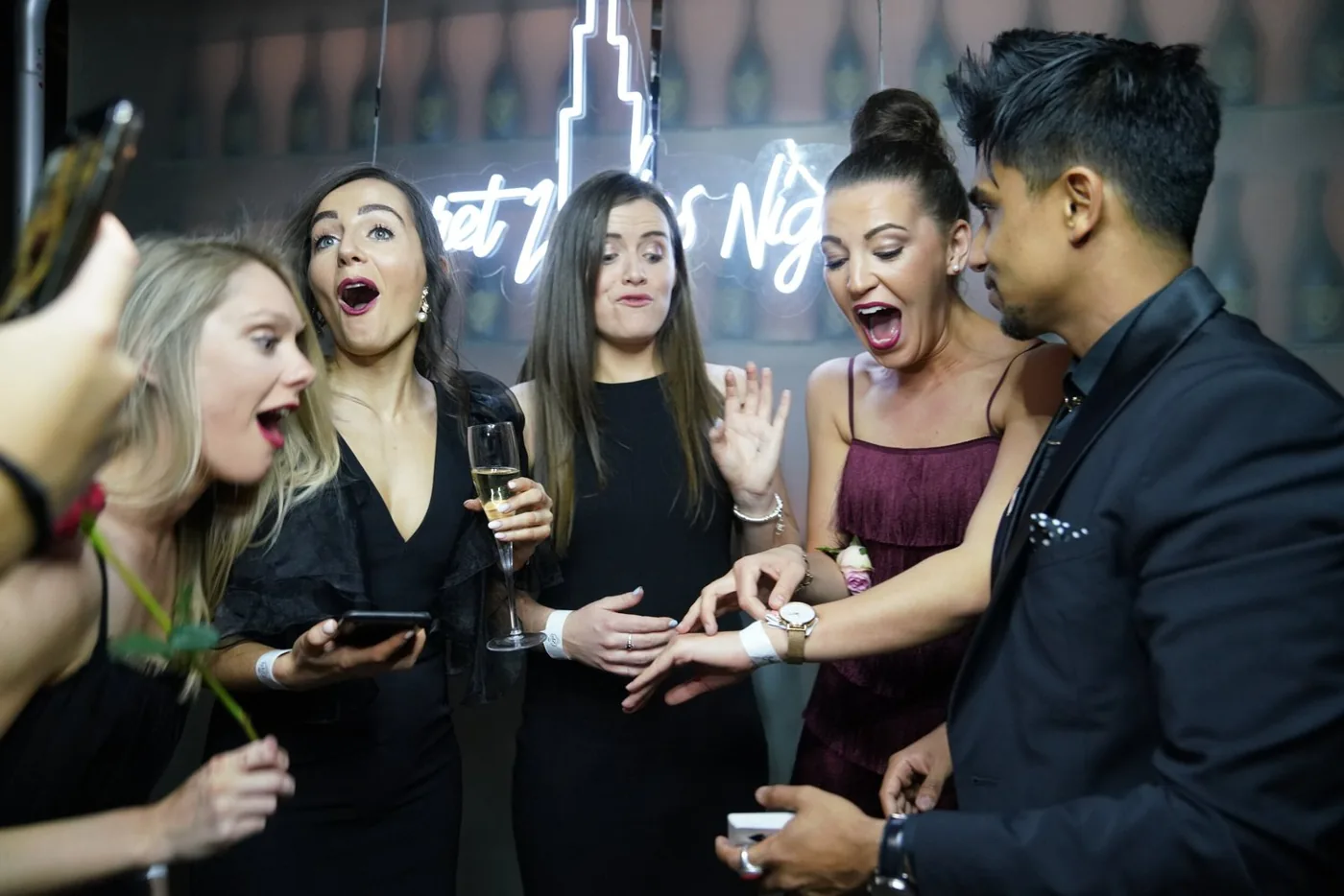 Guests react with surprise during Nabeel’s close-up performance.