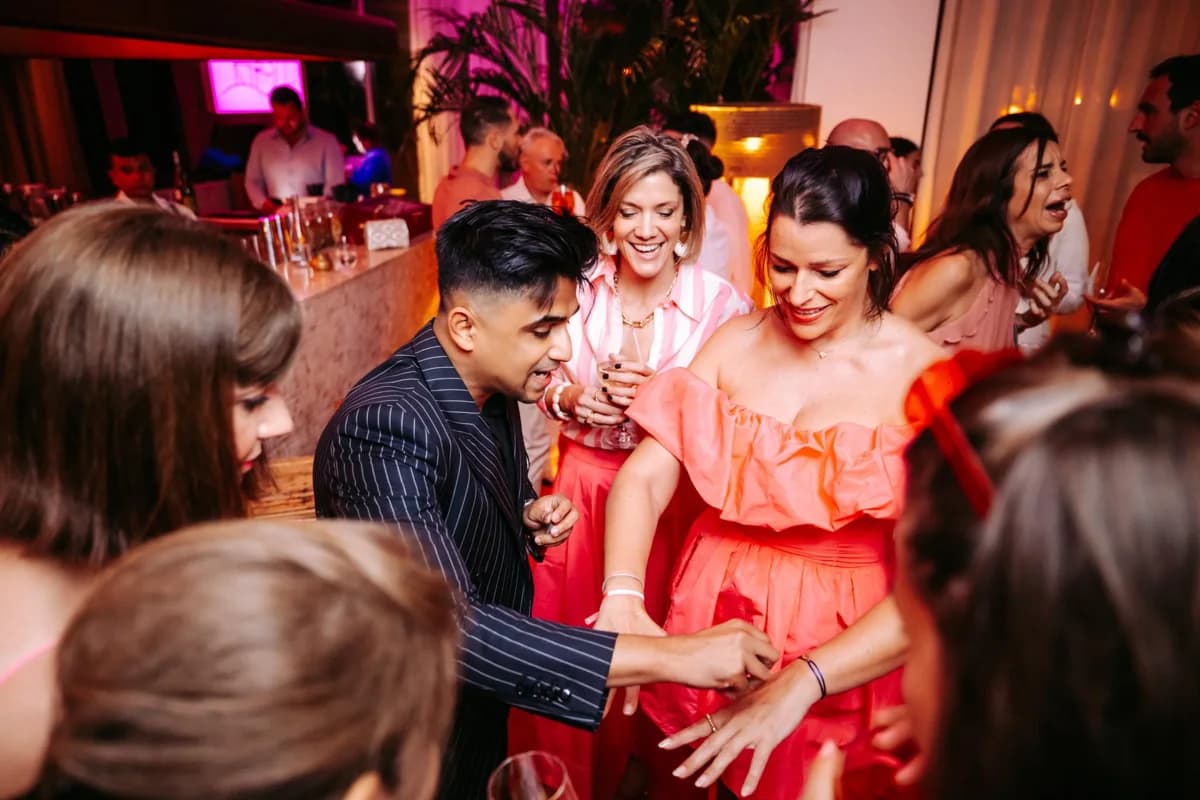 Nabeel performs for guests at a wedding celebration.